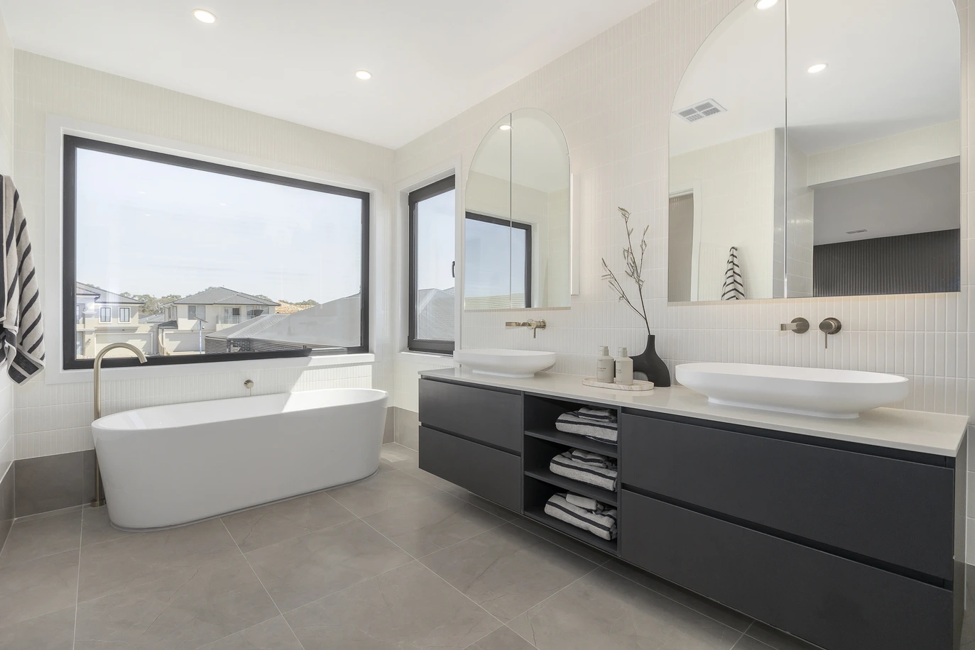 Beautiful modern bathroom with a large window and a small window