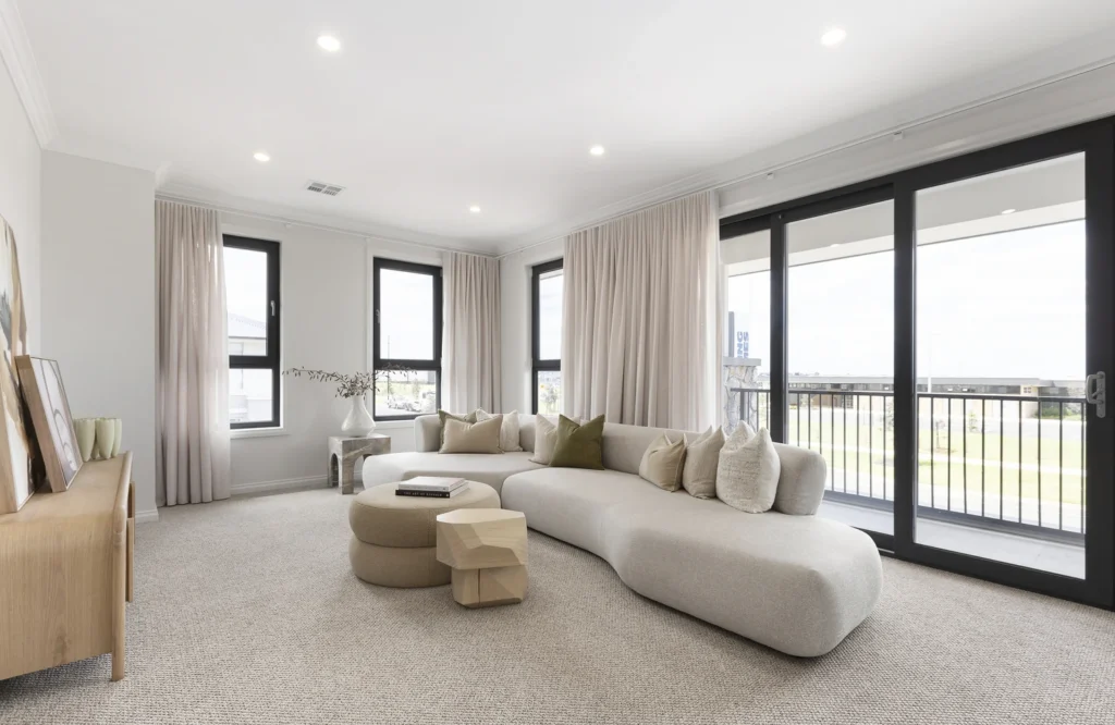 Modern living room with 3 windows and a large slide door with lots of natural light