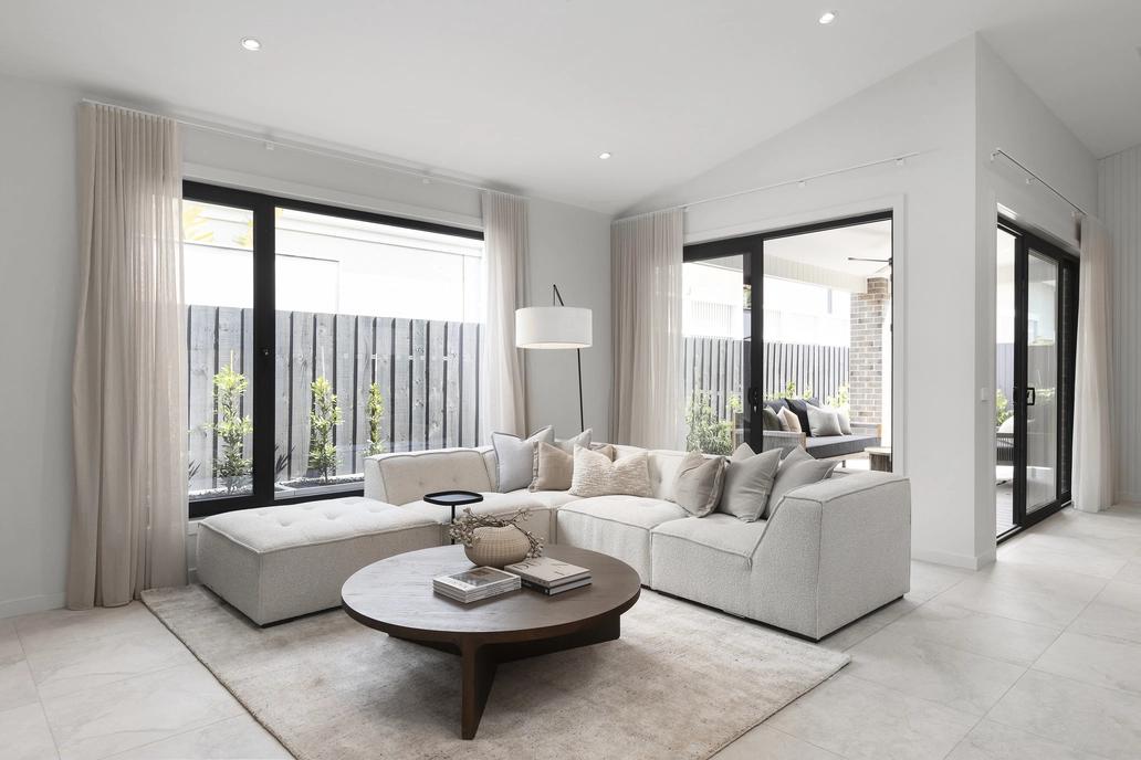 Bedroom with large windows letting in natural light