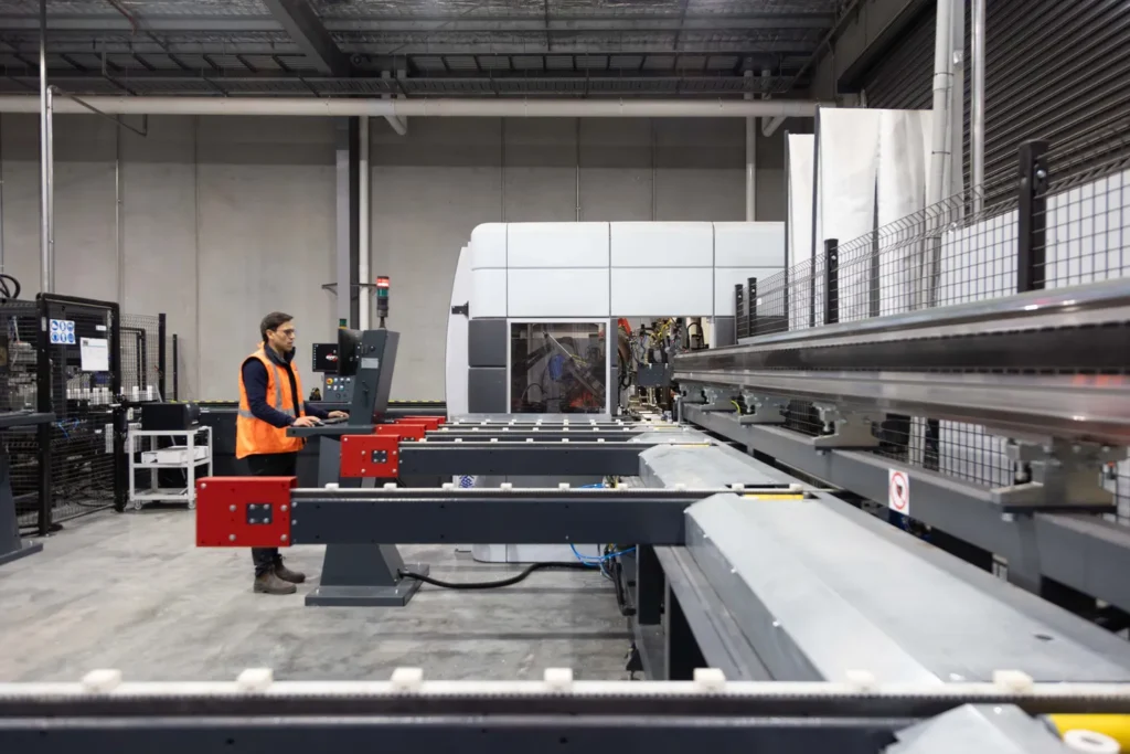 Perfect Windows and Doors worker working on the graf synergy machine